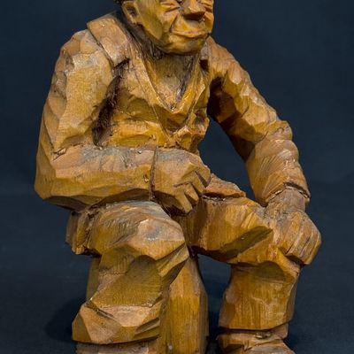 Pearson, Anton (1892-1967) seated man, woodcarving