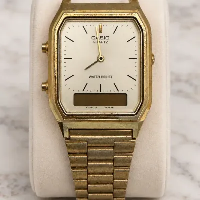 Vintage Casio AQ-230 Gold-Tone Analog Digital Quartz Watch with Broken Bracelet