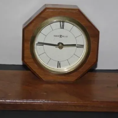 Vintage Howard Miller wooden desk clock and dual pen stand set, featuring an octagonal clock face with brass bezel and Roman numerals.
