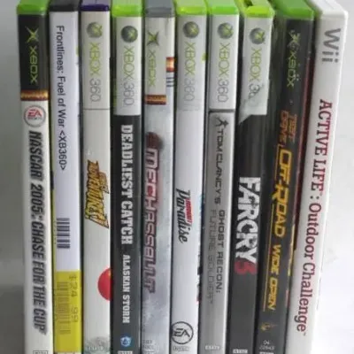Collection of ten video games for original Xbox, Xbox 360, and Nintendo Wii systems in cases.