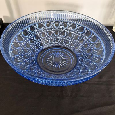 Sale Photo Thumbnail #22: Vintage light blue pressed glass serving bowl featuring a cane and starburst pattern with a ribbed rim.