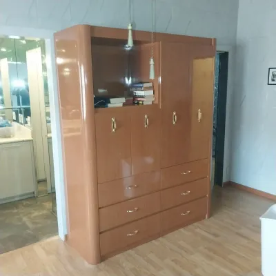 Sale Photo Thumbnail #10: Vintage 1980s Art Deco-style high-gloss lacquer armoire entertainment center featuring brass hardware and ample storage drawers.