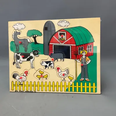 Sale Photo Thumbnail #255: Vintage Chadwick-Miller farm theme wooden peg puzzle featuring various barnyard animals and a farmer.