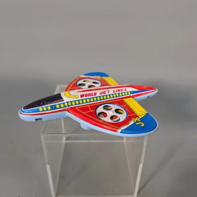 Sale Photo Thumbnail #270: Vintage tin litho friction airplane toy marked World Jet Lines, featuring colorful red, blue, and yellow graphics.