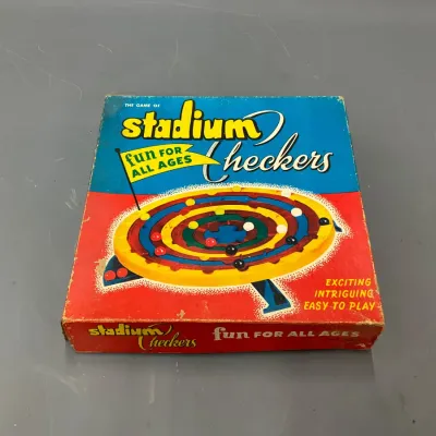 Sale Photo Thumbnail #294: Vintage Stadium Checkers board game box by Schaper, featuring vibrant mid-century graphics with noticeable wear along the edges.