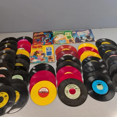 Sale Photo Thumbnail #379: Large collection of vintage 45 RPM children's records and read-along book sets, including Peter Pan, Golden Records, Batman, Casper, and Star Wars titles from the 1960s to 1980s.