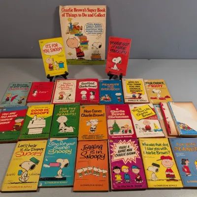 Sale Photo Thumbnail #391: Large collection of vintage Peanuts paperback comic books by Charles M. Schulz, including Charlie Brown's Super Book of Things to Do and Collect.