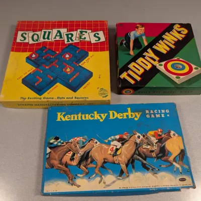 Sale Photo Thumbnail #198: Trio of vintage board games, including Squares by Schaper Manufacturing, Tiddly Winks, and Kentucky Derby Racing Game by Whitman, showing age-appropriate edge wear.