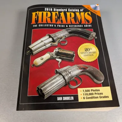 Sale Photo Thumbnail #24: 2010 Standard Catalog of Firearms: The Collector's Price & Reference Guide, 20th Anniversary Edition paperback book by Dan Shideler.