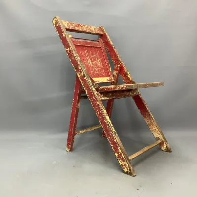 Sale Photo Thumbnail #283: Vintage red and yellow painted wooden folding high chair featuring distressed, chippy paint and rustic character.