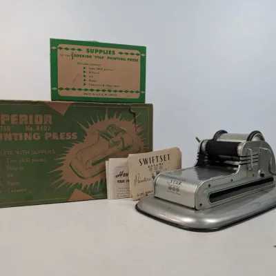 Sale Photo Thumbnail #84: Vintage Superior 'Star' No. 8403 printing press set with metallic press unit, original instructional booklets, and two green original boxes.