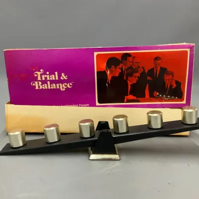 Sale Photo Thumbnail #397: Vintage Trial & Balance desktop balance game with brass-colored weights and original box.