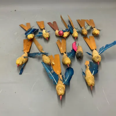 Sale Photo Thumbnail #293: Collection of vintage handmade bird ornaments, crafted with spun cotton or papier-mâché bodies, natural wood tails, and real dyed feather wings.