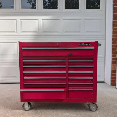 Sale Photo Thumbnail #85: Red U.S. General rolling double-bank tool chest cabinet with multiple drawers and heavy-duty casters.