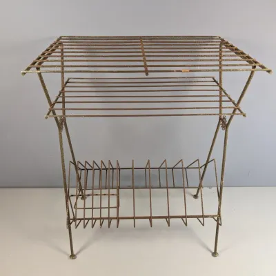 Sale Photo Thumbnail #157: Vintage mid-century wire record player stand with top shelves and bottom album storage rack, showing significant surface rust and patina.
