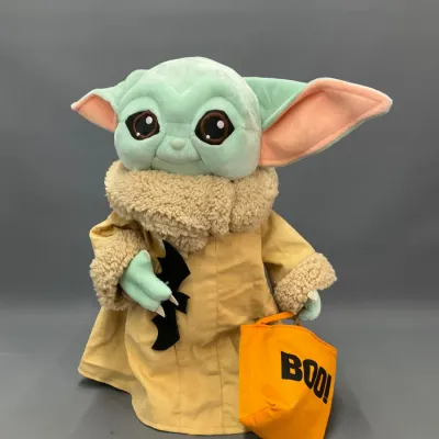 Sale Photo Thumbnail #251: Halloween-themed Star Wars Grogu (The Child) plush figure holding a black bat and an orange "BOO!" trick-or-treat bag.
