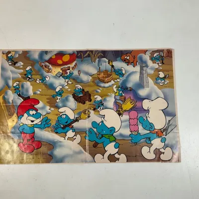 Sale Photo Thumbnail #99: Vintage Smurfs poster depicting Papa Smurf and various characters playing in a snowy Smurf village.