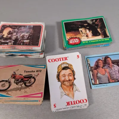 Sale Photo Thumbnail #383: Collection of vintage trading cards from the late 1970s and early 1980s, including Star Wars, The Dukes of Hazzard, and motorcycle themes.