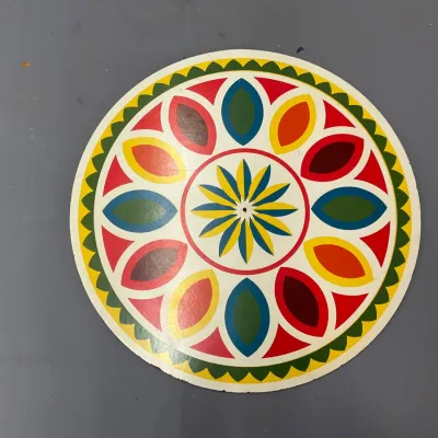 Sale Photo Thumbnail #237: Vintage circular Pennsylvania Dutch hex sign featuring a colorful geometric petal and star motif.