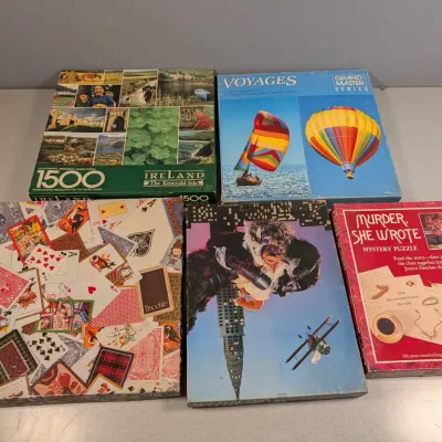 Sale Photo Thumbnail #181: Collection of five vintage jigsaw puzzles, including Springbok's Ireland The Emerald Isle, Voyages, and Murder, She Wrote Mystery Puzzle.