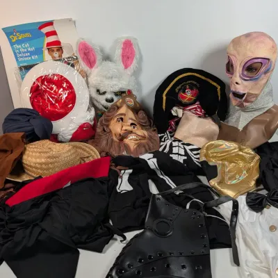 Sale Photo Thumbnail #38: Collection of assorted Halloween costumes, masks, and accessories, including a vintage Burger King mask, an alien mask, and a Dr. Seuss Cat in the Hat set.