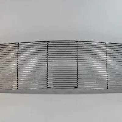 Sale Photo Thumbnail #37: Aftermarket chrome billet grille insert for an automobile, featuring horizontal bars and mounting tabs.