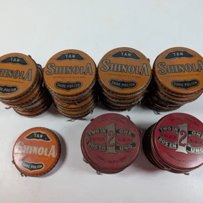 Sale Photo Thumbnail #68: Collection of vintage Shinola and 2 in 1 shoe polish tins, featuring stacked sets of orange tan polish and red black polish containers.