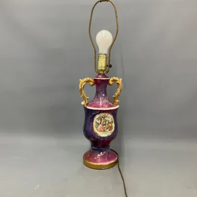 Sale Photo Thumbnail #287: Vintage porcelain urn table lamp in magenta and gold tones, featuring a printed coursing scene medallion and double scroll handles.