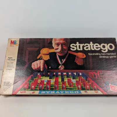 Sale Photo Thumbnail #425: Vintage Milton Bradley Stratego board game in its original box, featuring 1970s cover art.