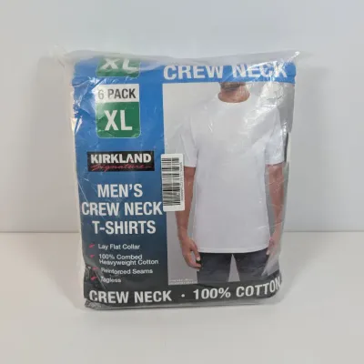 Sale Photo Thumbnail #32: Sealed 6-pack of Kirkland Signature men's white crew neck t-shirts, size XL, made of 100% combed heavyweight cotton.
