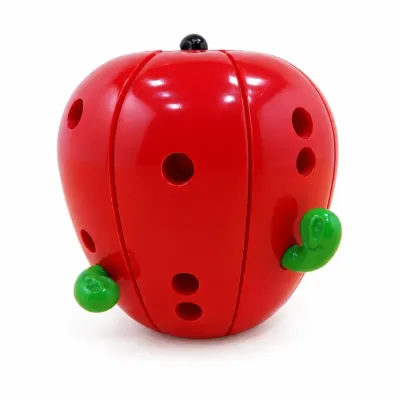 Sale Photo Thumbnail #426: Vintage red plastic apple puzzle toy featuring small holes and green worm details, showing minor light wear.