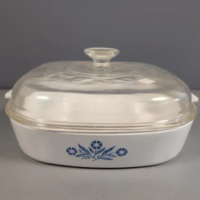 Sale Photo Thumbnail #119: Vintage Corning Ware square casserole dish in the classic Blue Cornflower pattern, complete with its original clear glass lid.