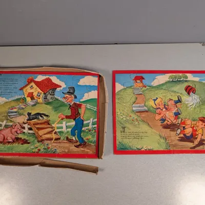 Sale Photo Thumbnail #20: Two vintage nursery rhyme frame tray puzzles featuring There Was a Crooked Man and Jack and Jill, shown with a worn original box.