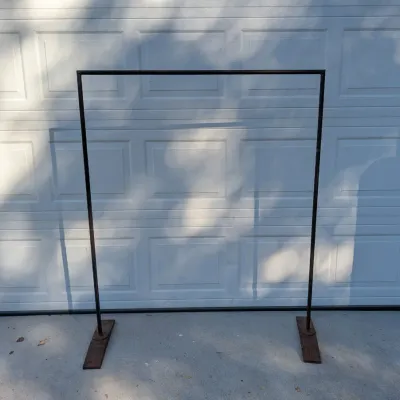 Sale Photo Thumbnail #268: Simple black metal clothing rack or background frame featuring a rectangular tubing construction and heavy rectangular metal feet.