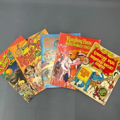 Sale Photo Thumbnail #396: Collection of vintage Ringling Bros. and Barnum & Bailey Circus souvenir program books and an official coloring book, featuring colorful cover artwork.