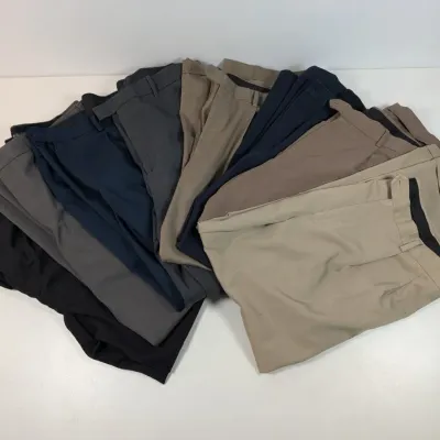 Sale Photo Thumbnail #33: Large fan-shaped collection of men's trousers in various neutral shades, including beige, charcoal, navy, and black.