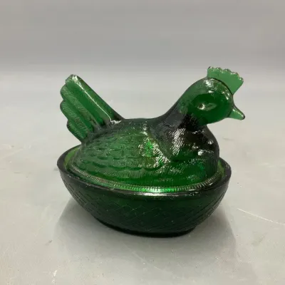 Sale Photo Thumbnail #285: Vintage green glass hen on a nest covered dish, featuring a textured basketweave base and detailed feather styling.