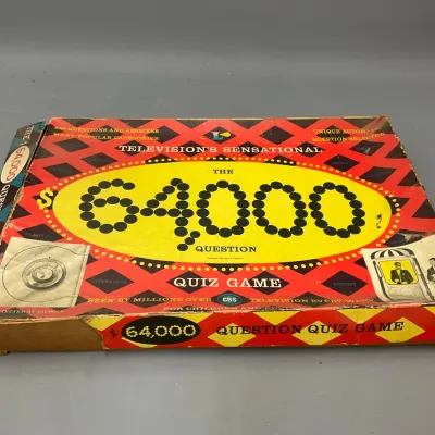 Sale Photo Thumbnail #220: Vintage 1955 The $64,000 Question Quiz Game board game by Lowell Toy Corp, based on the CBS television show, showing wear to the box edges and corners.