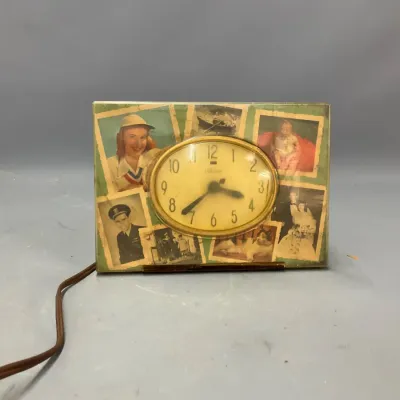 Sale Photo Thumbnail #232: Vintage Telechron electric picture frame desk clock featuring a collage of mid-century photographs.