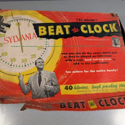 Sale Photo Thumbnail #191: Vintage 1950s Beat the Clock board game by Lowell Toy Corp., featuring host Bud Collyer on the heavily worn box cover.