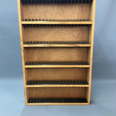 Sale Photo Thumbnail #103: Vintage light wood cassette tape storage rack featuring five slotted shelves with plastic dividers.