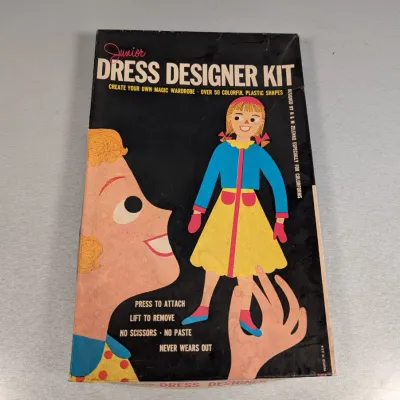 Sale Photo Thumbnail #200: Vintage Junior Dress Designer Kit by Colorforms, featuring colorful mid-century illustration art on the original box.
