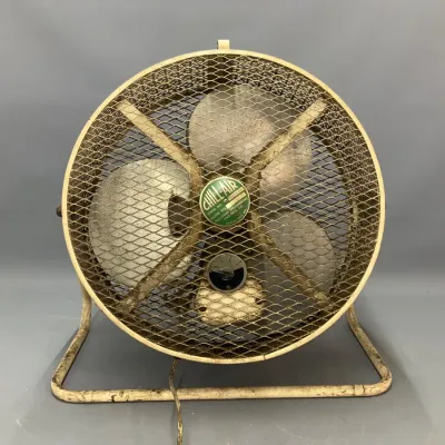 Sale Photo Thumbnail #260: Vintage Chill-Air electric hassock/floor fan with metal mesh cage and tubular stand, mid-20th century.