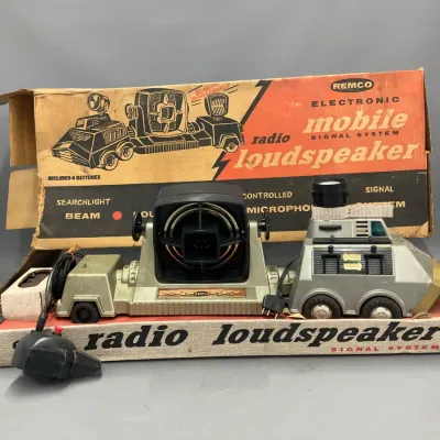 Sale Photo Thumbnail #259: Vintage 1950s Remco electronic mobile radio loudspeaker toy with original box, microphone, and searchlight feature.