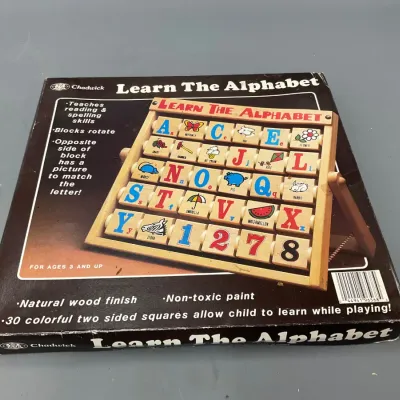 Sale Photo Thumbnail #254: Vintage Chadwick "Learn The Alphabet" wooden spinning block toy in original box, featuring letters, numbers, and pictures.