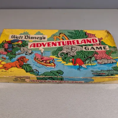 Sale Photo Thumbnail #187: Vintage Parker Brothers Walt Disney's Adventureland Game box featuring colorful jungle artwork, showing noticeable edge and corner wear.