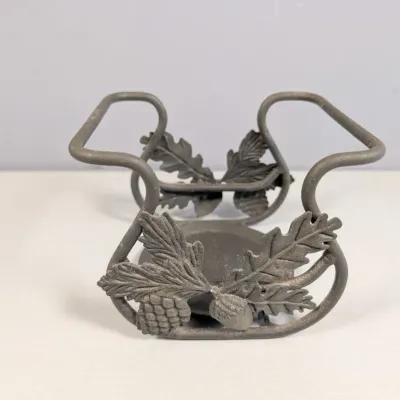 Sale Photo Thumbnail #139: Cast metal napkin or jar holder with a pewter finish, decorated with molded acorn, pinecone, and oak leaf accents.