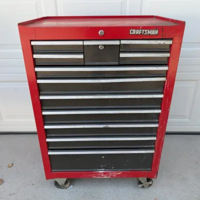 Sale Photo Thumbnail #95: Red and black Craftsman rolling tool chest featuring multiple drawers with aluminum trim and key locks.