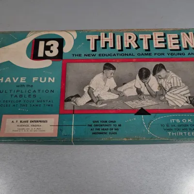 Sale Photo Thumbnail #201: Vintage 1955 "Thirteen" educational multiplication table board game box by A. F. Blake Enterprises, displaying mild edge wear.