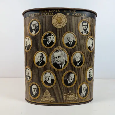 Sale Photo Thumbnail #56: Vintage metal trash can featuring portraits of US Presidents set against a faux woodgrain background, ending with Lyndon B. Johnson.